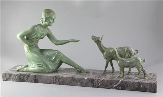 D.H. Chiparus. An Art Deco patinated bronze figure of a girl feeding goats, height 14in. length 22.75in.
